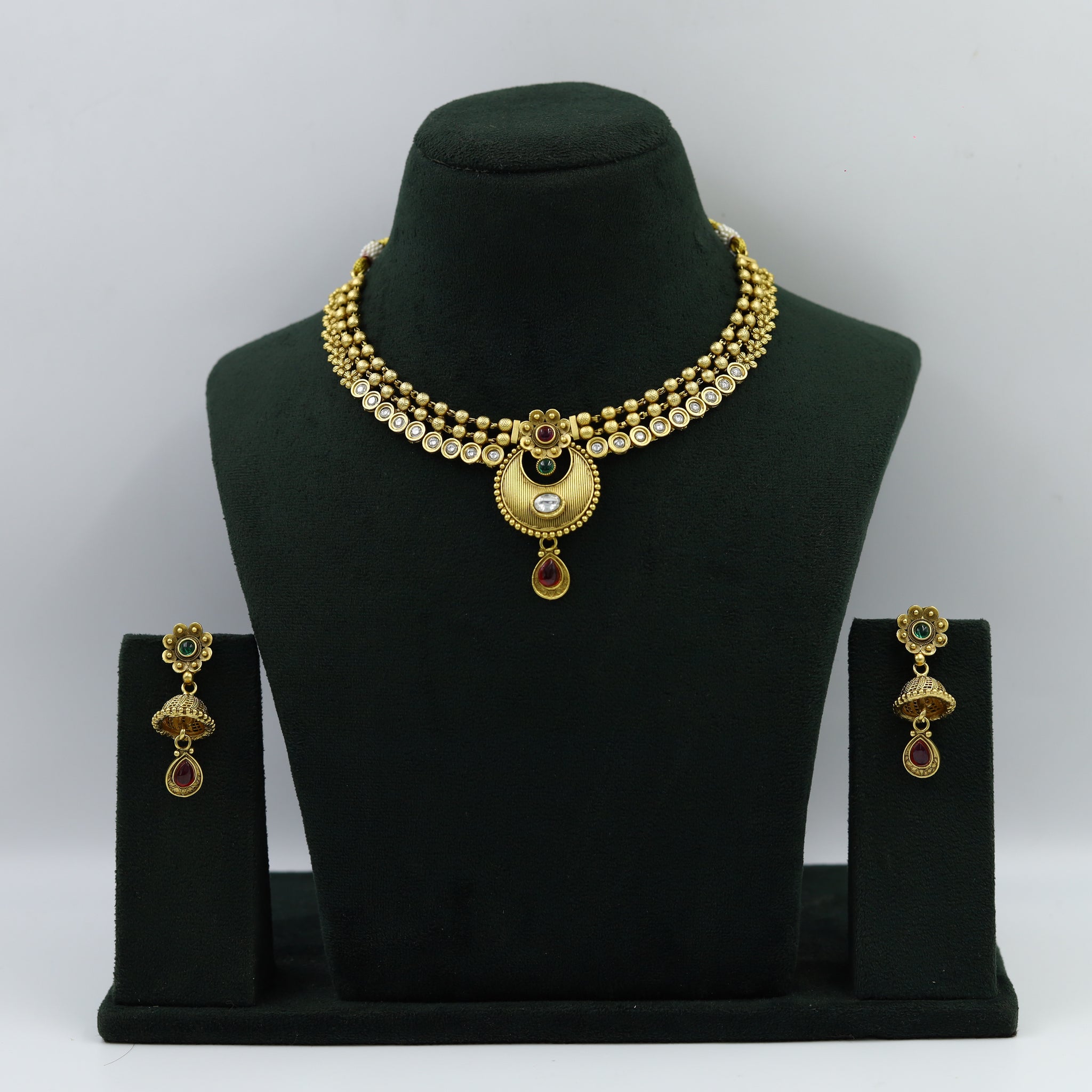 Round Neck Beautiful Gold Look Necklace Set With Ruby And Green Stone