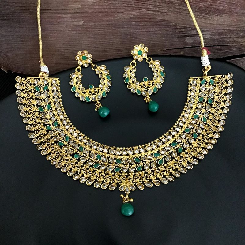 Beautiful Heavy Polki Round Neck Necklace Set With Green Stones - Matching Chandbali